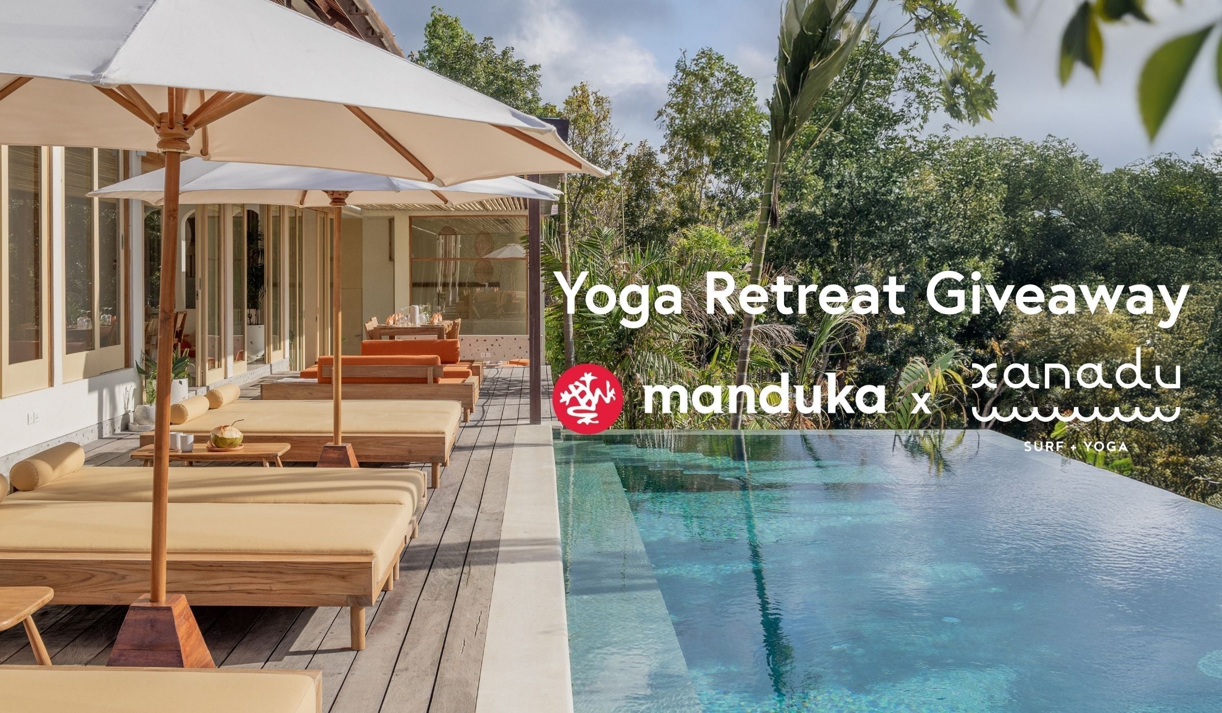 A serene poolside view features lounge chairs under umbrellas, surrounded by lush greenery and a glistening infinity pool.