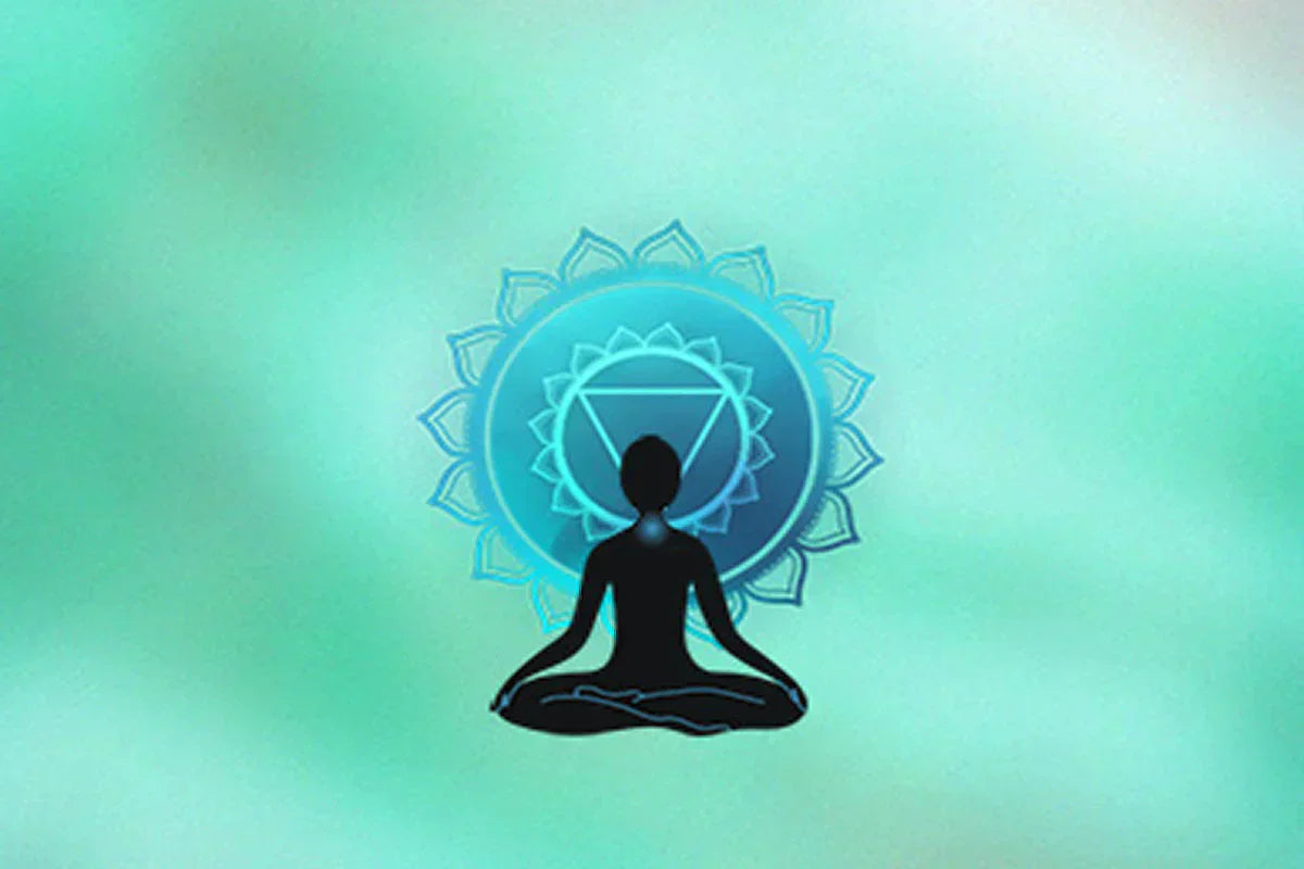 A silhouetted figure meditating in lotus position, surrounded by a blue chakra symbol, against a soft green background.