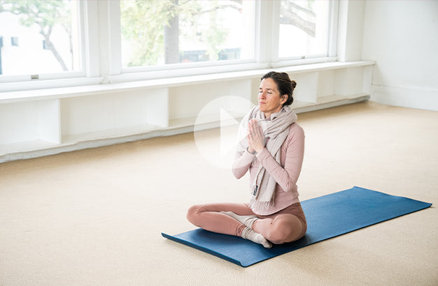 Linda Baffa sitting in a yoga pose